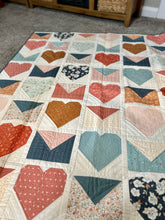 Load image into Gallery viewer, Colorful heart-patterned quilt made of cotton, featuring various shades and floral designs, perfect for home décor.