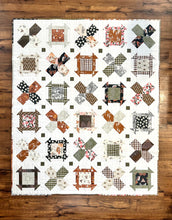 Load image into Gallery viewer, Colorful quilt featuring floral and geometric patterns in warm tones, made from cotton fabric for cozy comfort.