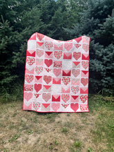 Load image into Gallery viewer, Handmade quilt featuring red and pink hearts and envelopes, perfect for cozying up or gifting.
