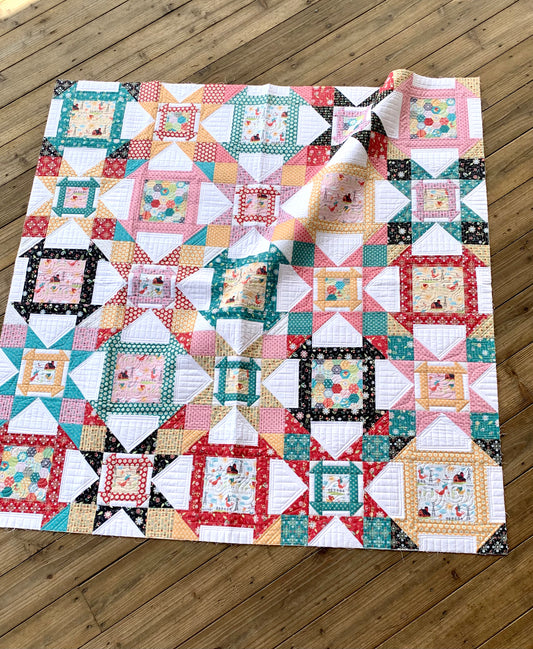 Colorful patchwork quilt with floral and geometric patterns, made from cotton fabric, perfect for home decor.