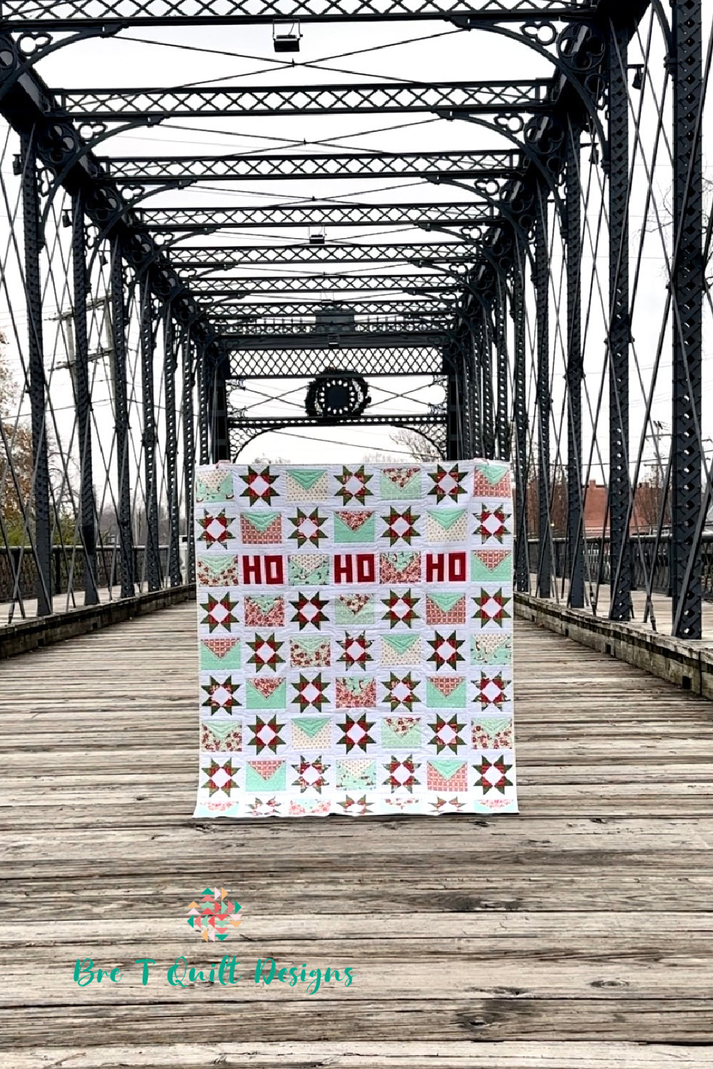 Colorful holiday quilt featuring red and mint stars, perfect for festive home decor.
